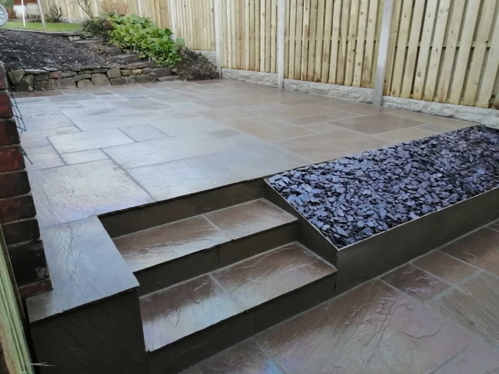 Paving with inset steps and slate feature border